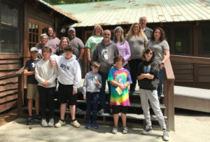 group standing in front of the dining hall at Millstone 4-H camp